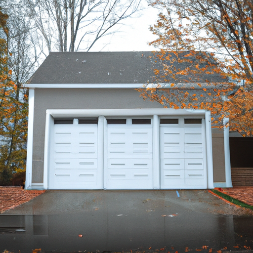 Suburban Sudbury garage door on a detached home in late autumn with wet leaves on the driveway.